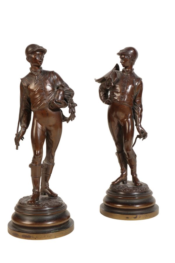 A PAIR OF PATINATED BRONZE MODELS OF JOCKEYS,