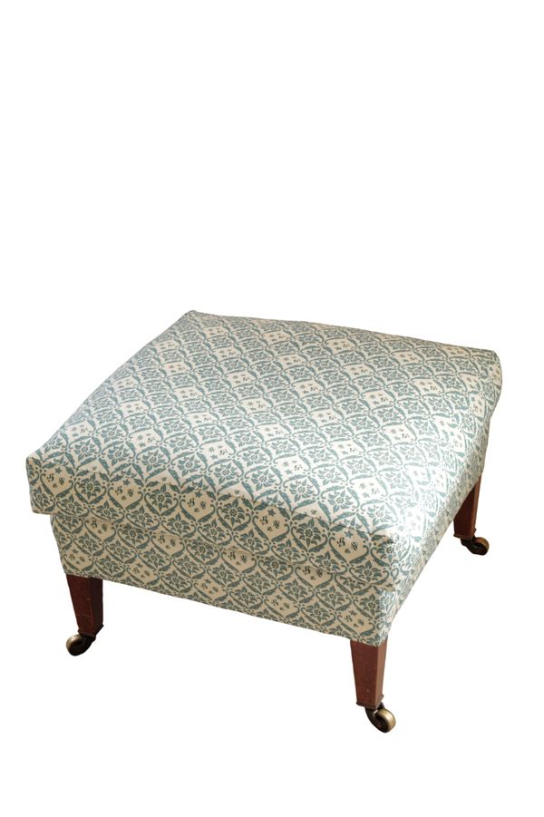 A LATE VICTORIAN OR EDWARDIAN UPHOLSTERED STOOL, BY HOWARD & SONS,