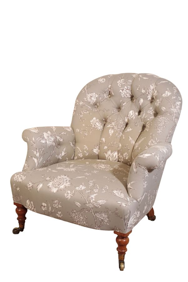 A VICTORIAN UPHOLSTERED ARMCHAIR, PROBABLY BY HOWARD & SONS,