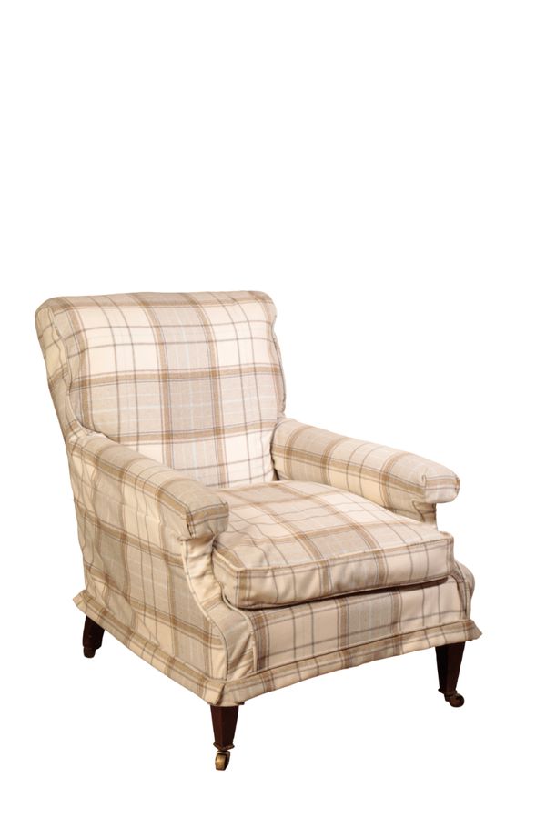 A VICTORIAN UPHOLSTERED ARMCHAIR, IN THE MANNER OF HOWARD & SONS,