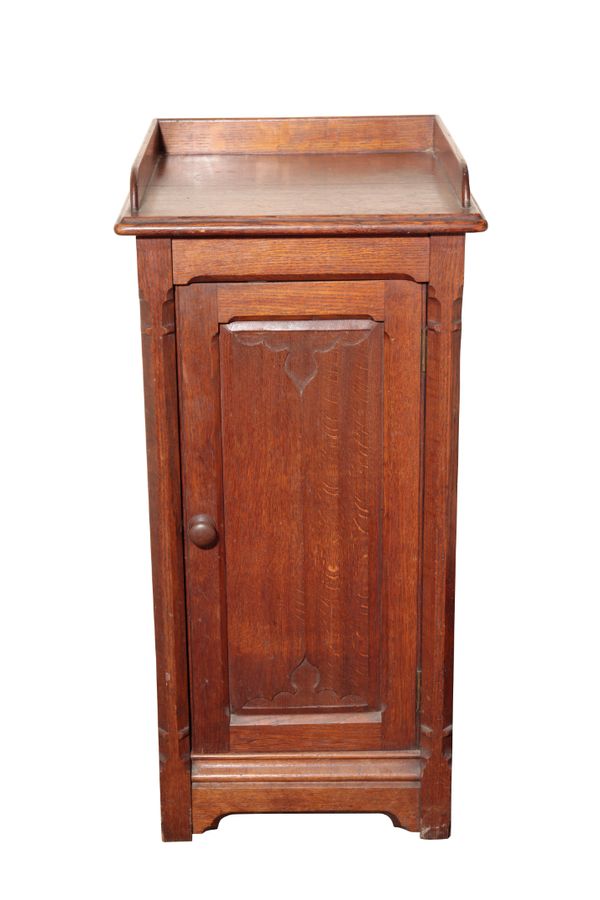 A VICTORIAN OAK BEDSIDE CUPBOARD IN GOTHIC STYLE, IN THE MANNER OF A.W.N. PUGIN AND ALMOST CERTAINLY BY GILLOWS,