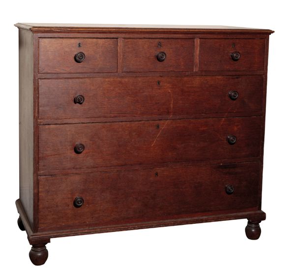 AN OAK CHEST OF DRAWERS, BY GILLOWS,