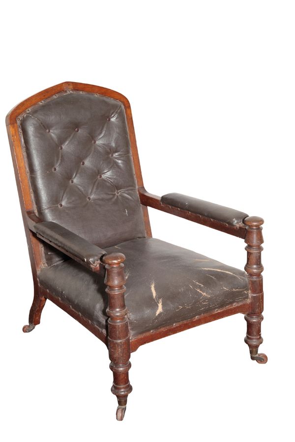 A VICTORIAN OAK AND UPHOLSTERED LIBRARY ARMCHAIR, IN GOTHIC STYLE, POSSIBLY IRISH,