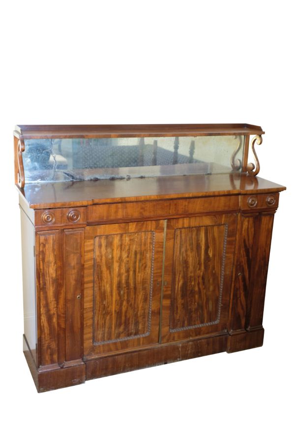 A REGENCY MAHOGANY INVERTED BREAKFRONT SIDE CABINET,