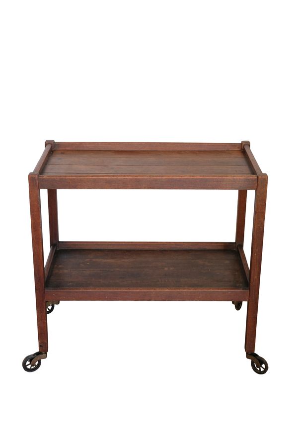 A STAINED OAK TEA TROLLEY,