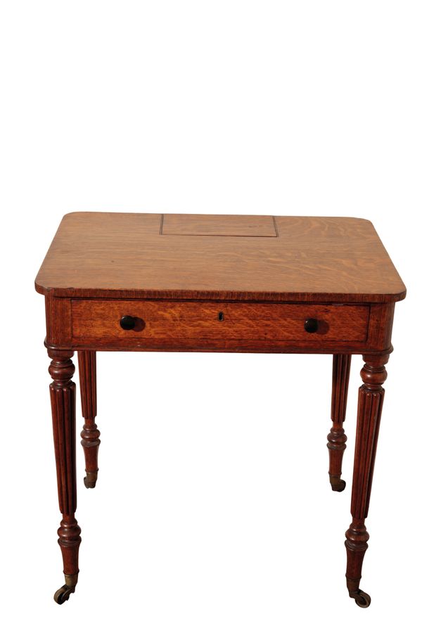 A REGENCY OR GEORGE IV OAK CHAMBER WRITING TABLE, FIRMLY ATTRIBUTABLE TO GILLOWS,