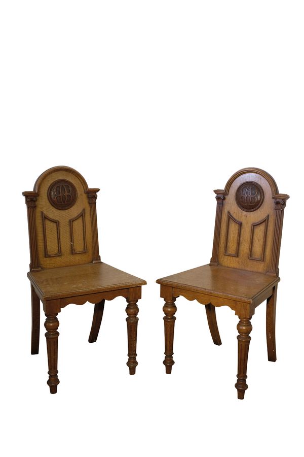 A PAIR OF GEORGE IV OAK HALL CHAIRS, BY T.H. FILMER & SONS,