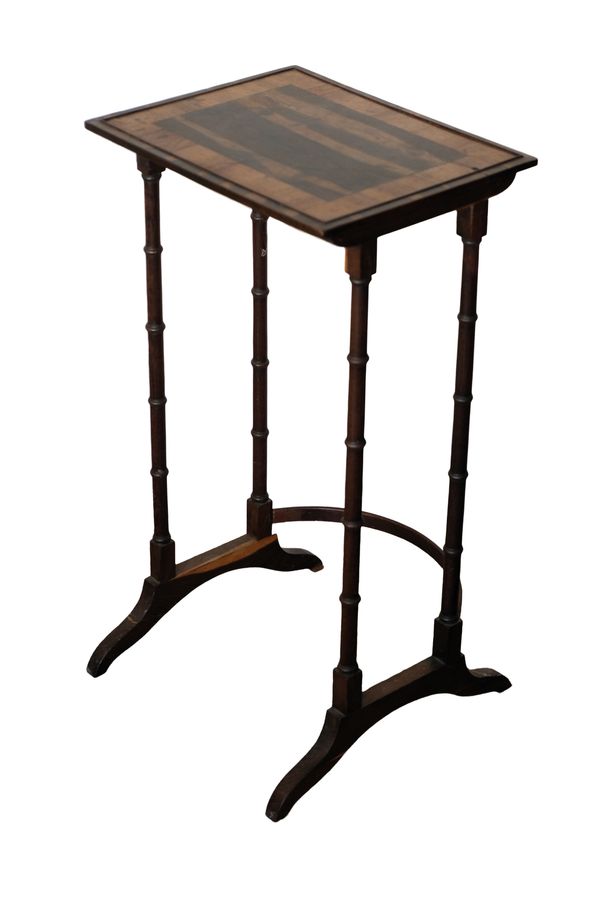 A REGENCY WALNUT AND LABURNUM QUARTETTO TABLE,