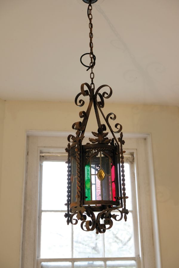 A WROUGHT IRON AND GLAZED HALL LANTERN, IN GOTHIC STYLE,