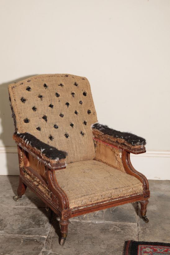 A VICTORIAN OAK AND UPHOLSTERED LIBRARY ARMCHAIR, BY HOLLAND & SONS,