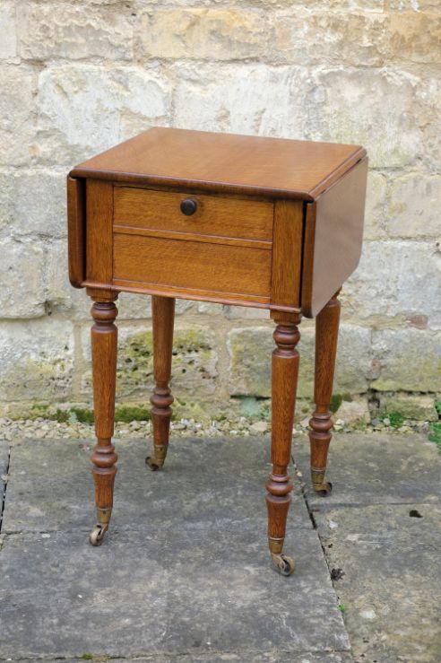 A REGENCY OAK DROP LEAF POT CUPBOARD, ATTRIBUTED TO GILLOWS,