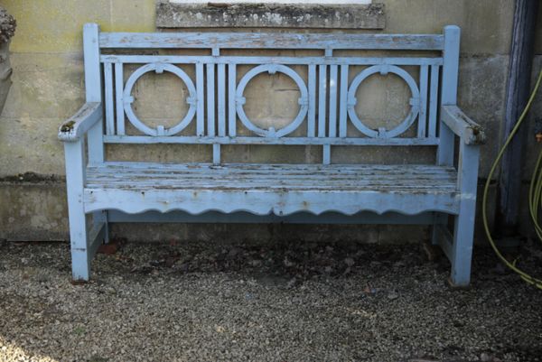 A BLUE PAINTED TEAK GARDEN BENCH, IN THE MANNER OF DESIGNS BY LUTYENS,