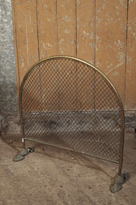 A VICTORIAN GILT METAL AND MESH FIREGUARD