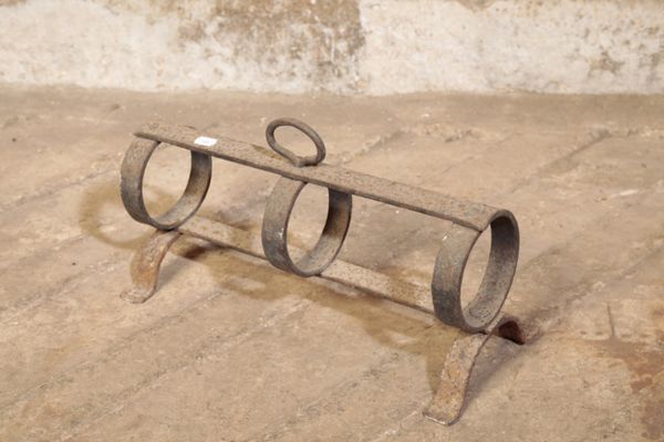 A GEORGE III WROUGHT IRON PIPE WARMER,