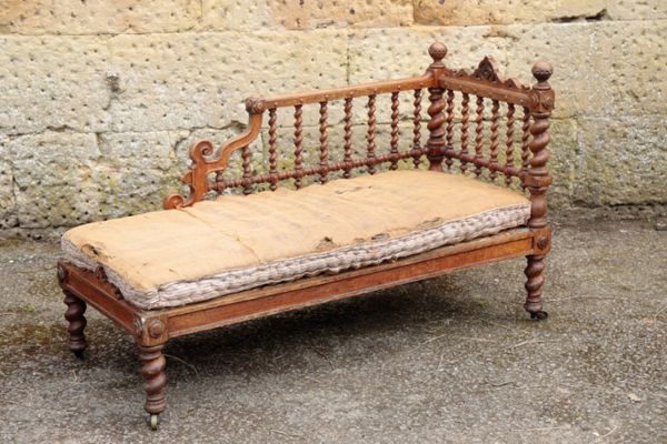 A VICTORIAN OAK DAY BED, IN ARTS AND CRAFTS STYLE AFTER SELWYN, POSSIBLY BY GILLOWS,