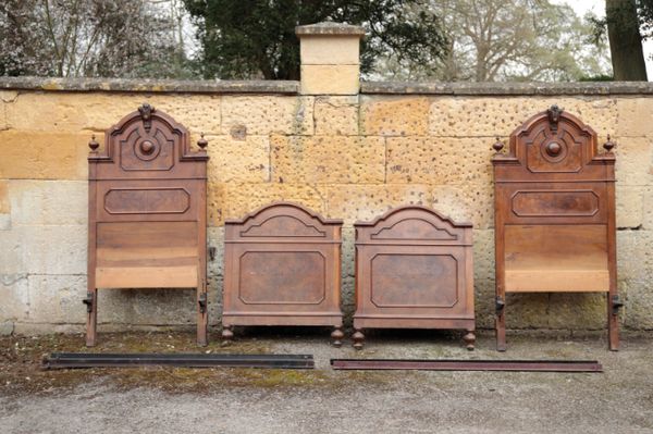 A PAIR OF ITALIAN WALNUT AND BURR WALNUT SINGLE BEDS,