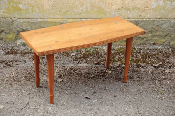 NEIL MORRIS FOR MORRIS OF GLASGOW; A COIN INSET HARDWOOD AND LAMINATE COFFEE TABLE,