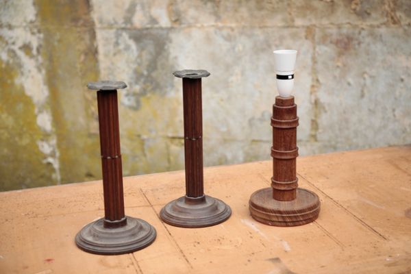 A PAIR OF EARLY VICTORIAN MAHOGANY AND METAL-MOUNTED CANDLESTICKS,