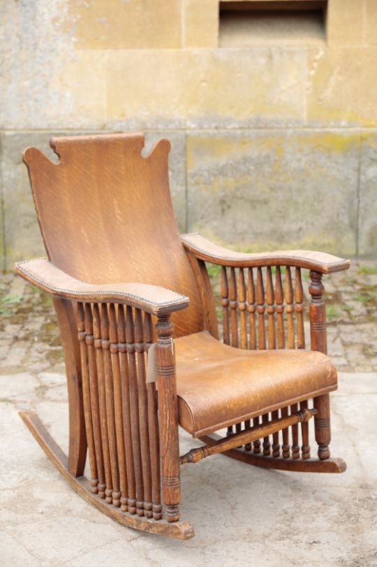 AN OAK ROCKING CHAIR,