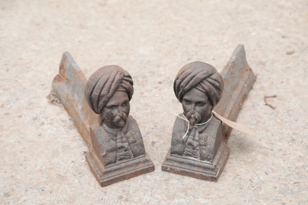 A PAIR OF VICTORIAN CAST IRON ANDIRONS, CAST AS TURKS' HEADS,