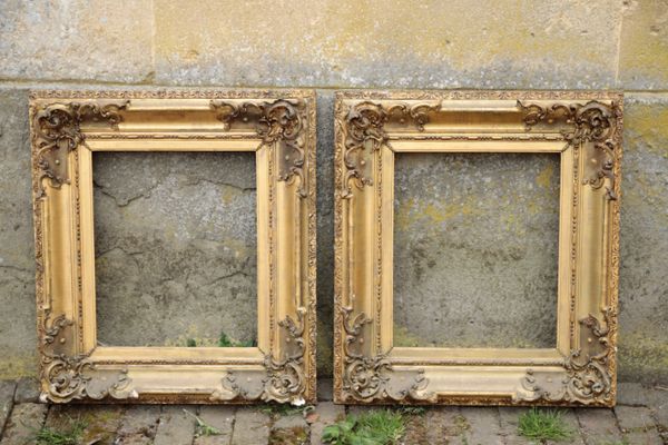 A PAIR OF GILTWOOD AND COMPOSITION PICTURE FRAMES IN 18TH CENTURY STYLE,