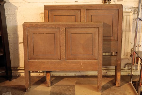 A PAIR OF OAK SINGLE BEDS, IN AESTHETIC STYLE,