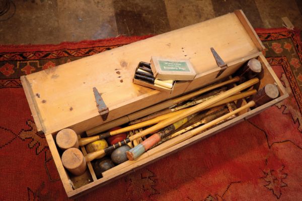 A PINE CASED CROQUET SET,