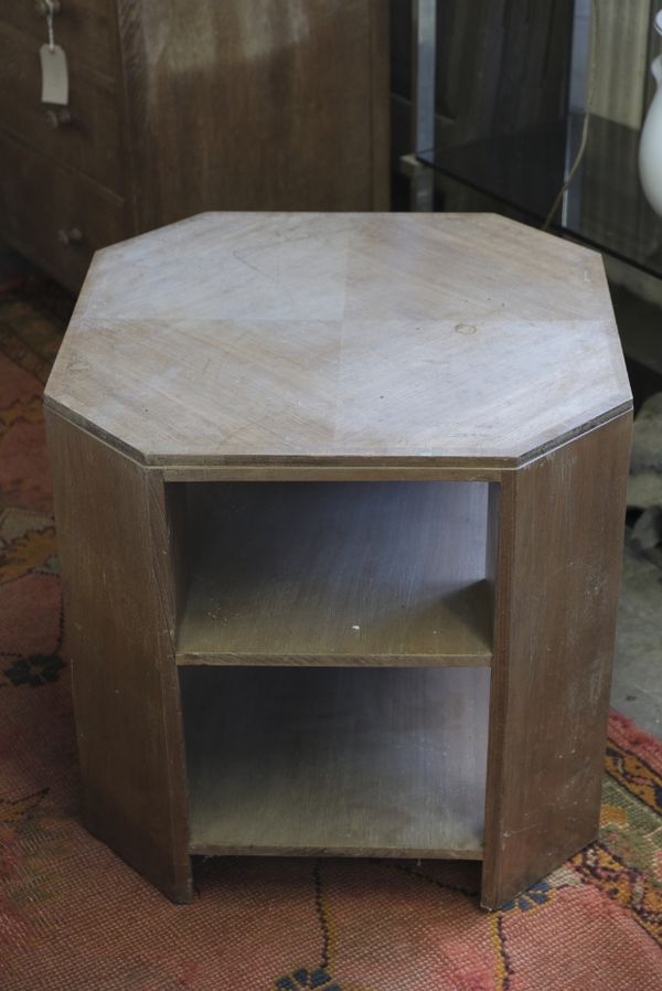 A WALNUT AND CROSSBANDED REVOLVING BOOKCASE IN ART DECO STYLE, BY MAPLE & CO.,