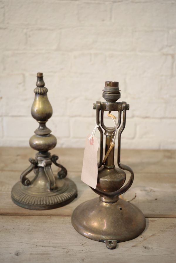 A GIMBALLED BRASS WALL AND TABLE LAMP,