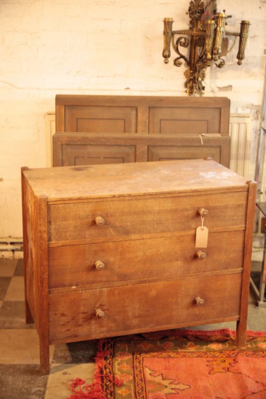 AN OAK CHEST OF DRAWERS, BY HEAL & SON LTD.,