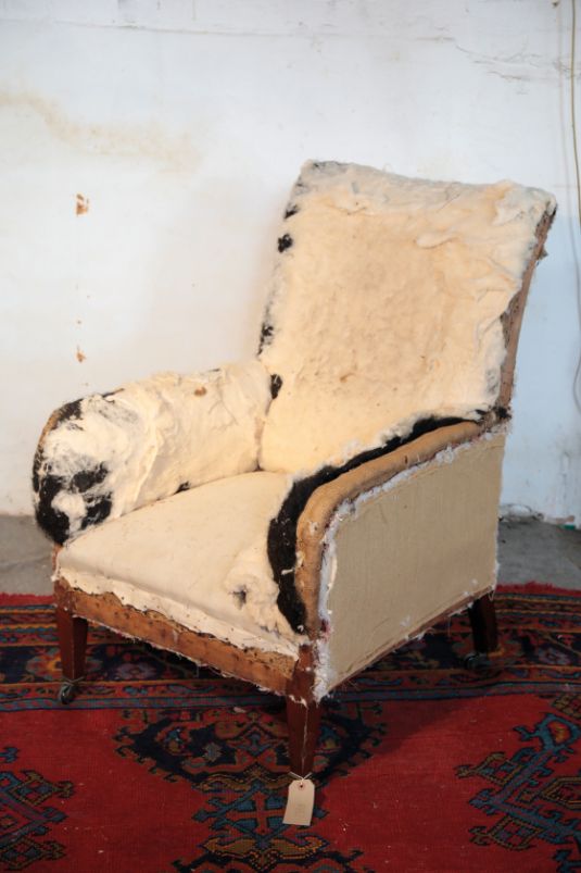 A VICTORIAN UPHOLSTERED ARMCHAIR,