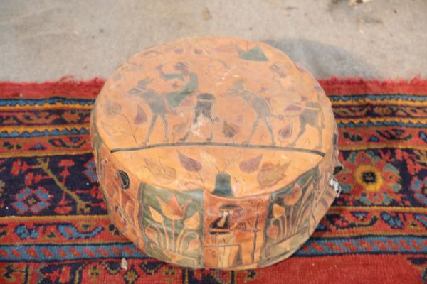 A NORTH AFRICAN COLLAGE LEATHER CENTRE POUFFE,