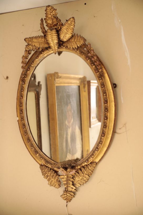 A VICTORIAN GILT COMPOSITION FRAMED PTERIDOMANIA OVAL WALL MIRROR,