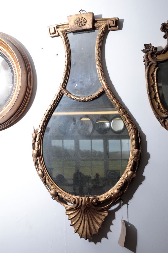 A VICTORIAN GILTWOOD FRAMED WALL MIRROR,