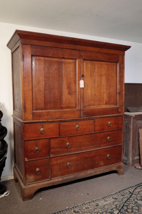 A LATE GEORGE III OAK HOUSEKEEPER'S CUPBOARD,