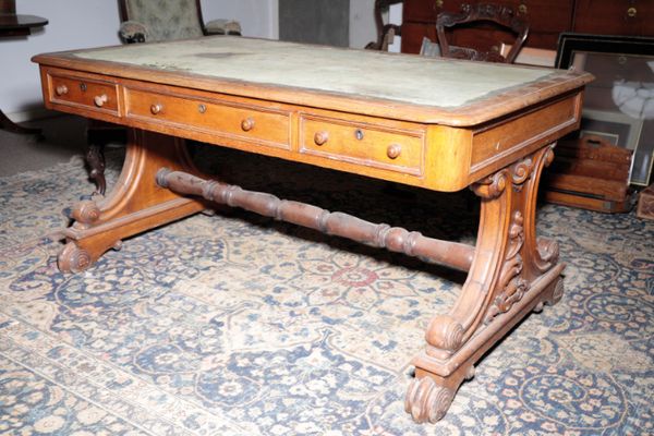 A IRISH VICTORIAN OAK PARTNERS' WRITING TABLE, BY ROBERT STRAHAN,