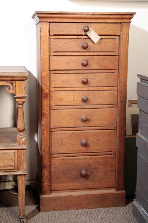 A VICTORIAN OAK WELLINGTON CHEST,