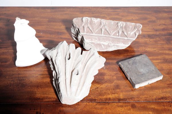 TWO CARVED LIMESTONE ARCHITECTURAL FRAGMENTS,