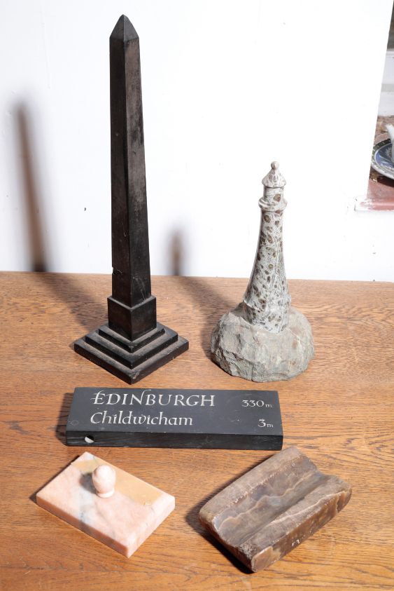 A CORNISH 'SERPENTINE' POLISHED LIMESTONE MODEL OF A LIGHTHOUSE,