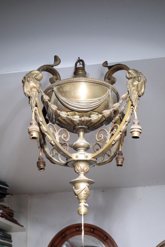 A GILT BRASS FOUR LIGHT ELECTROLIER IN NEOCLASSICAL STYLE,