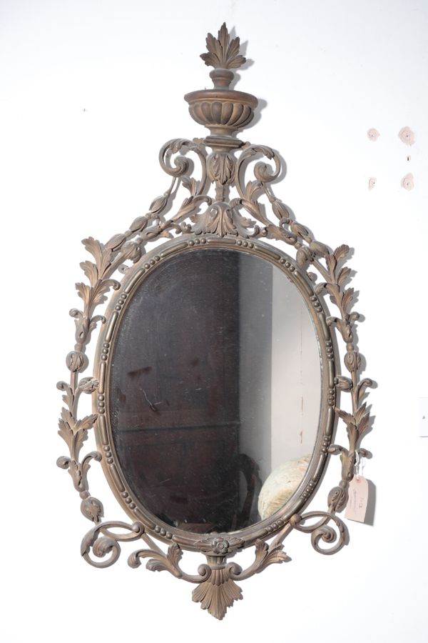 A CARVED AND GILTWOOD FRAMED OVAL WALL MIRROR, IN 18TH CENTURY STYLE,