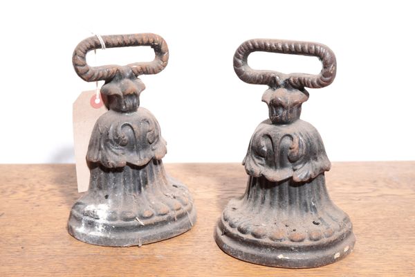 A PAIR OF REGENCY CAST IRON DOOR PORTERS,