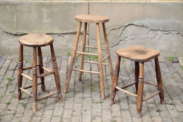 THREE VARIOUS ENGLISH ELM, OAK AND BEECH STOOLS,