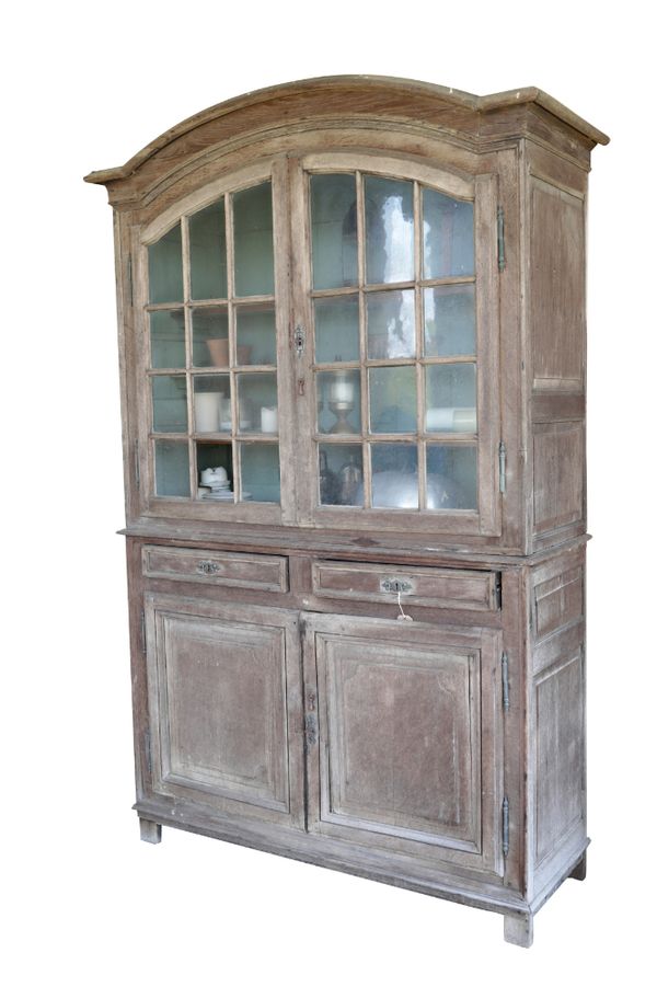 A LARGE CONTINENTAL OAK AND GLAZED SIDE CABINET,