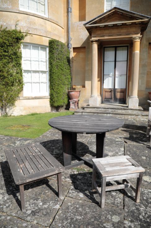 A TEAK GARDEN TABLE,