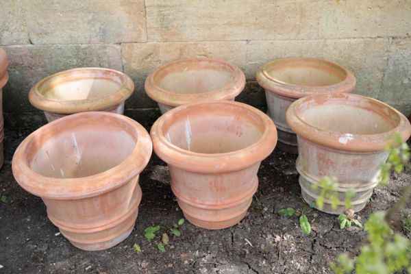 A SET OF SIX ITALIAN TERRACOTTA GARDEN URNS,