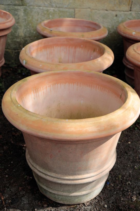 A SET OF THREE ITALIAN TERRACOTTA GARDEN URNS,