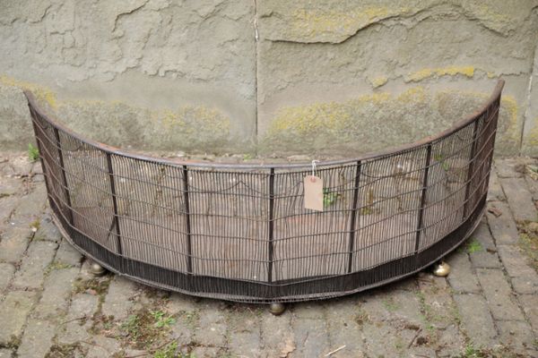 A  VICTORIAN WROUGHT IRON, MESH AND BRASS MOUNTED NURSERY FENDER,