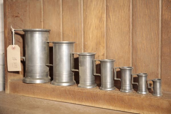 A SET OF SEVEN FRENCH PEWTER MEASURES,