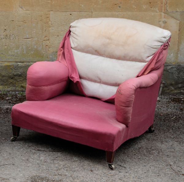 AN UPHOLSTERED IVOR ARMCHAIR, BY HOWARD & SONS,